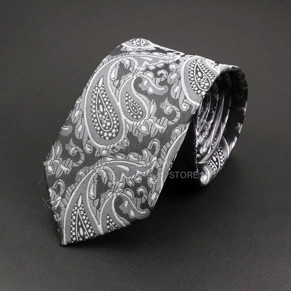 Black paisley patterned tie on a black background