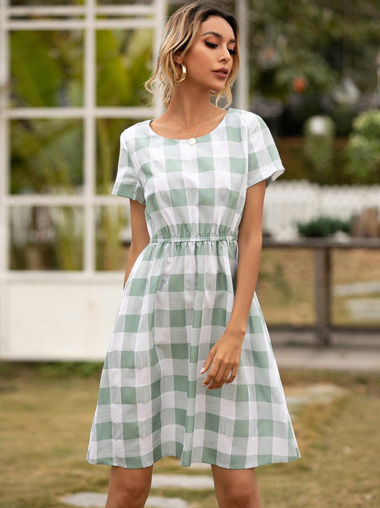 Smocked Plaid Round Neck Short Sleeve Dress Carauana Store