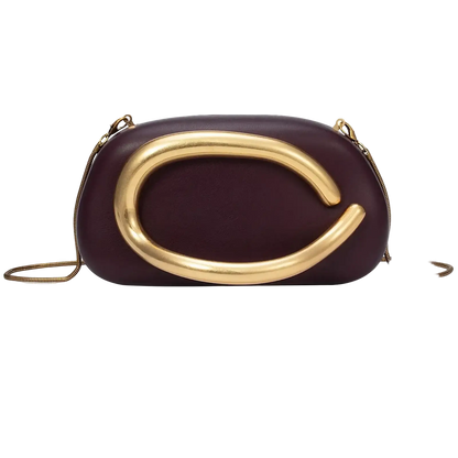 Purple handbag with gold clasp on a white background