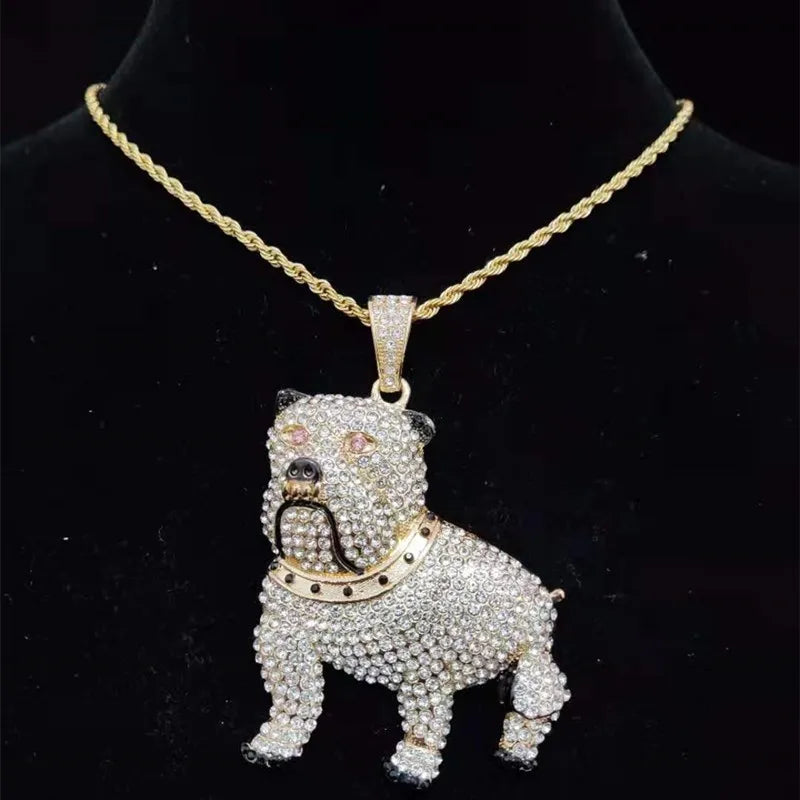Dog-shaped pendant with clear stones on a gold chain against a black background
