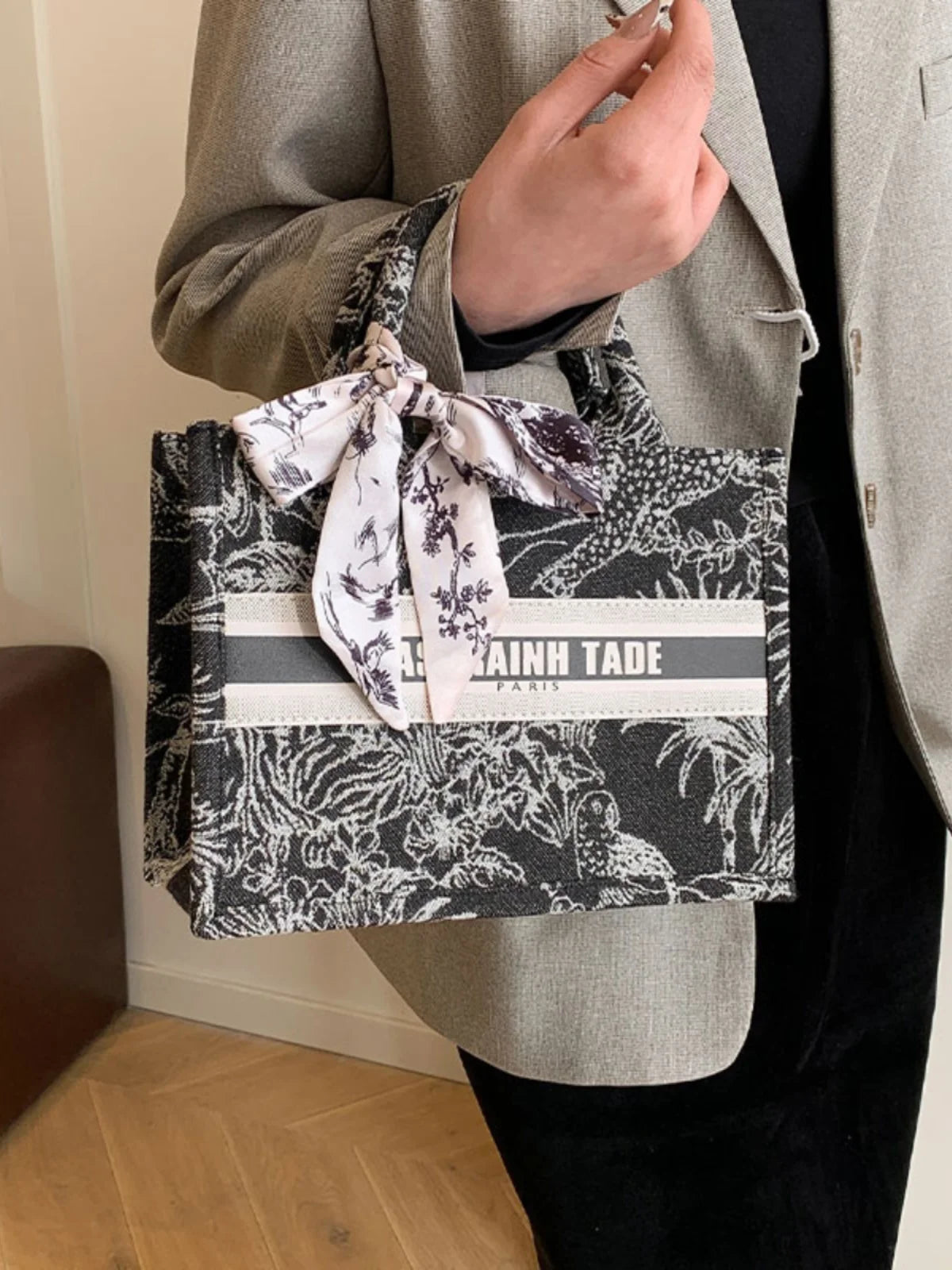 Person holding a black and white patterned