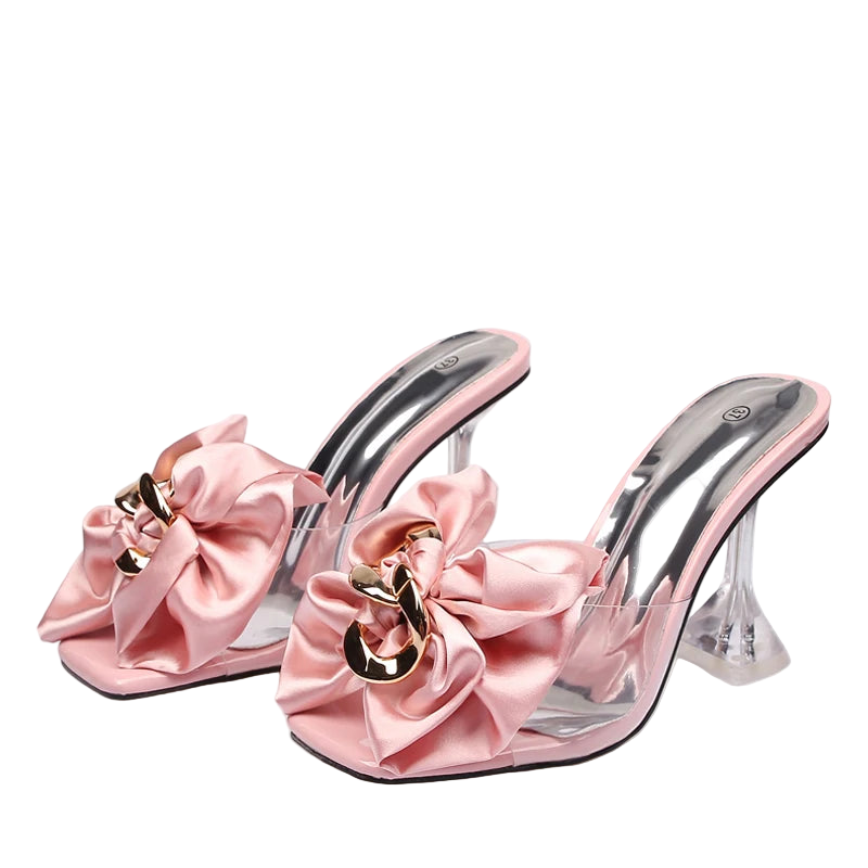 Pink high-heeled shoes with large bows